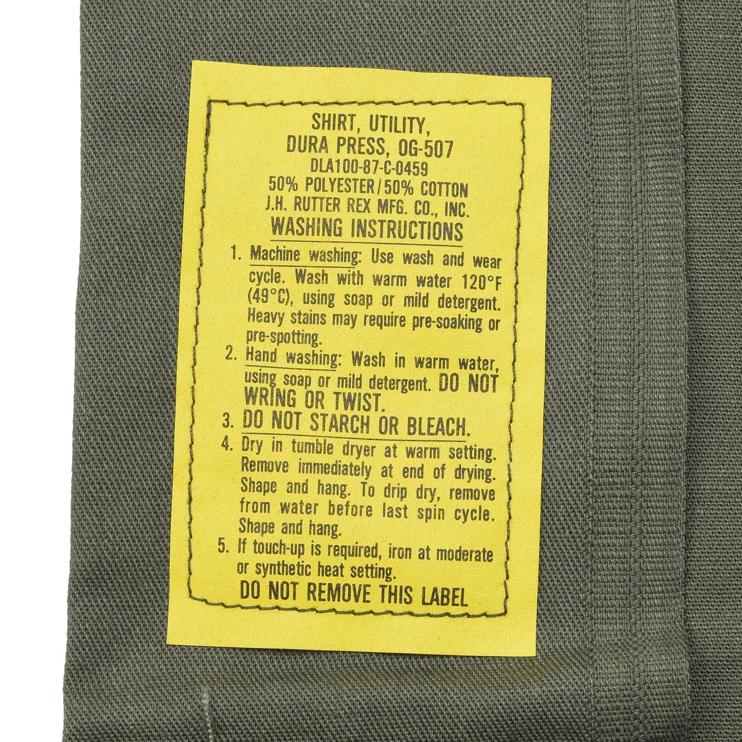 Jungtinių Valstijų kariuomenės kasdieniai marškiniai ilgomis rankovėmis Alyvuogių su plovimo instrukcijomis.