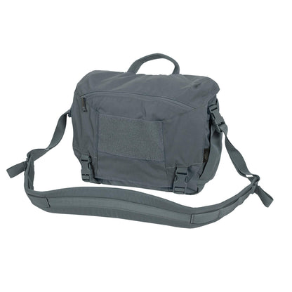 Helikon-Tex Urban Courier Medium kariuomenės stiliaus krepšys su reguliuojamu peties diržu ir Velcro panele.
